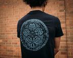 Black unisex short-sleeved In the Streets T-shirt with Tokyo manhole cover on the back in grey ink