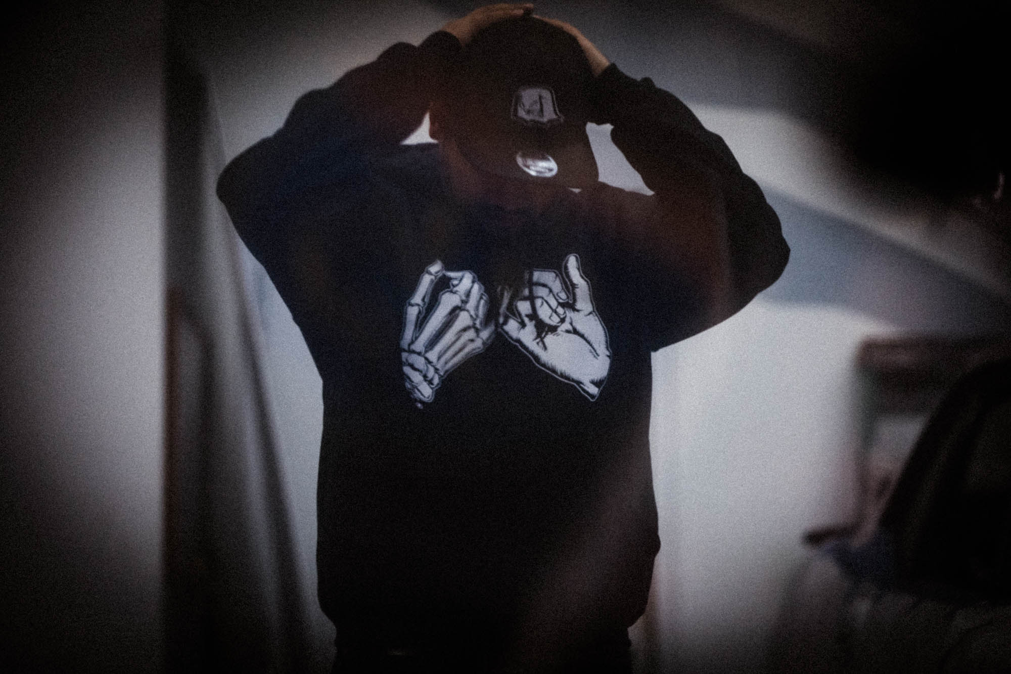 Unisex black hoodie with promise (Yakusoko) design on front in white ink and black cloud Kuro Kumo Japanese kanji characters in gray on back.