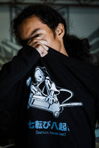 Black unisex cotton long-sleeved T-shirt with frontside scare skateboarding jack design on front in white and gray ink.