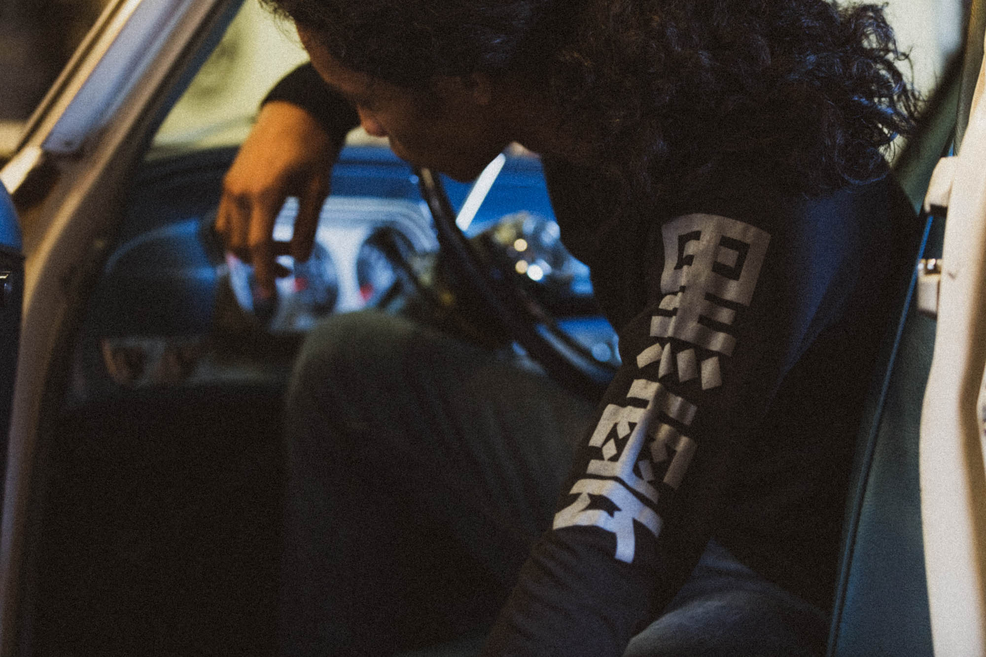 Black unisex cotton long-sleeved T-shirt with frontside scare skateboarding design on front in white and gray ink. Black cloud kanji in gray down the sleeves.