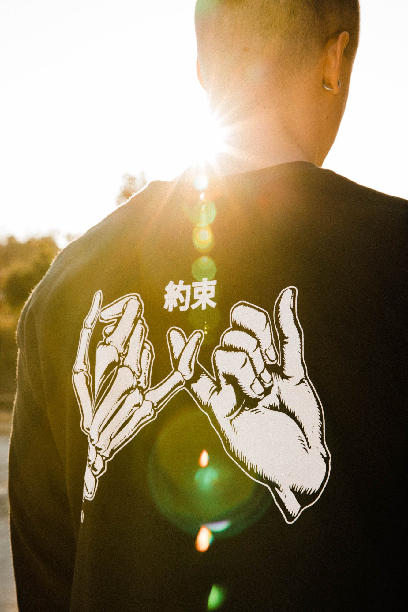 Black unisex cotton long-sleeved T-shirt with yakusoku (promise) design on back