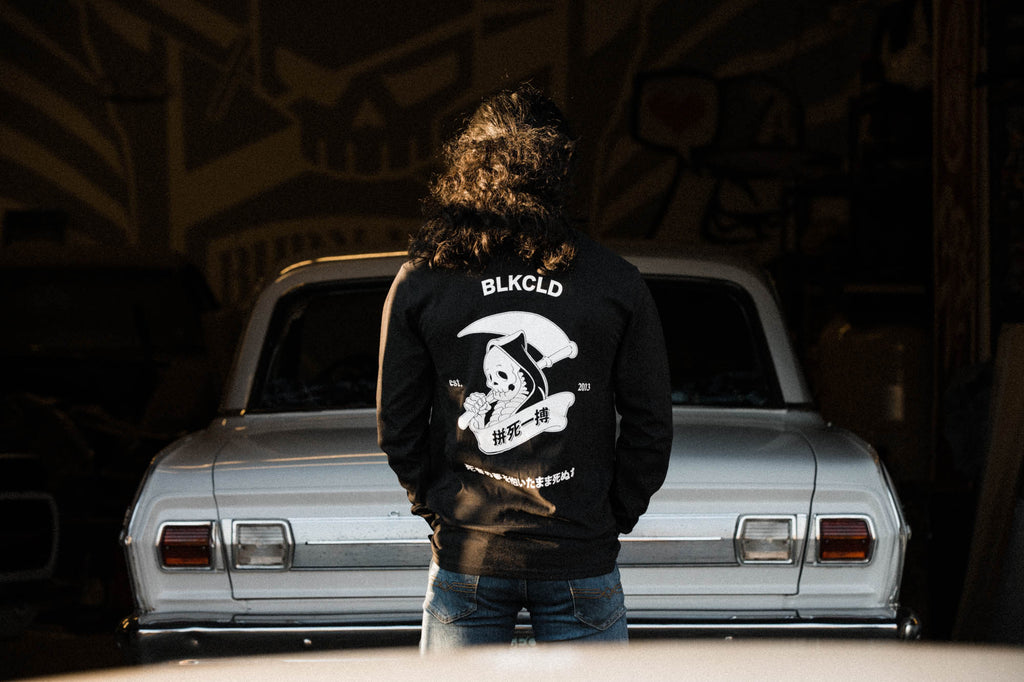 Black unisex cotton long-sleeved T-shirt with Grim Reaper Do or Die design on back in white ink. 