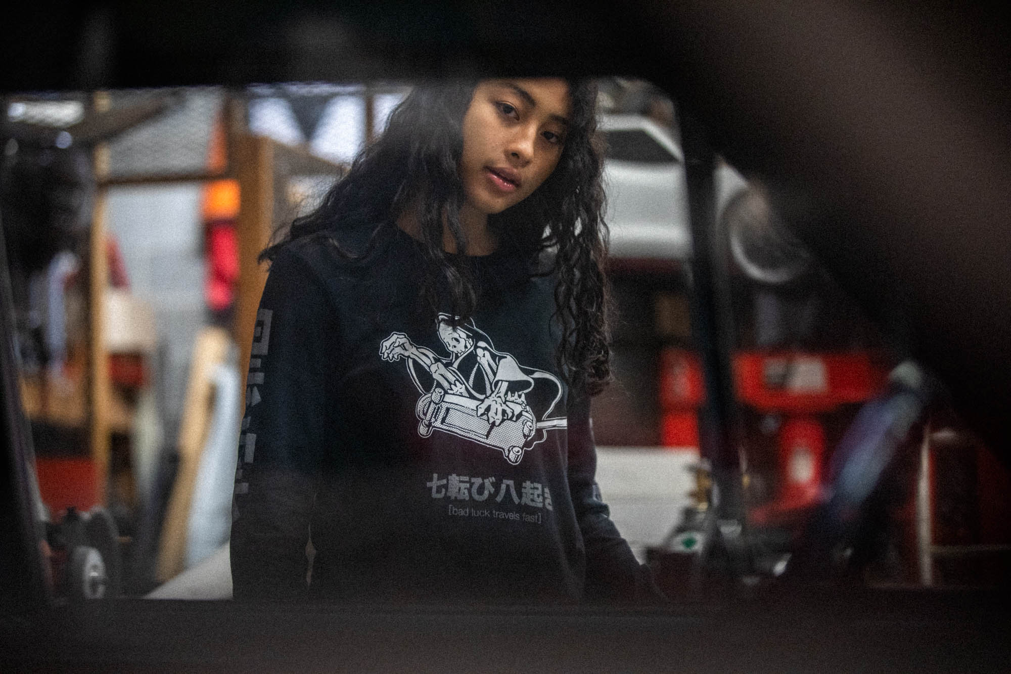 Black unisex cotton long-sleeved T-shirt with frontside scare skateboarding jack design on front in white and gray ink. Black cloud kanji in gray down the sleeves.