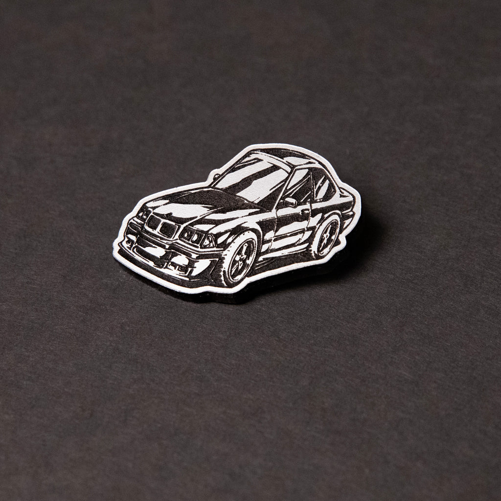 Silver and black engraved chibi BMW E36 acrylic lapel pin