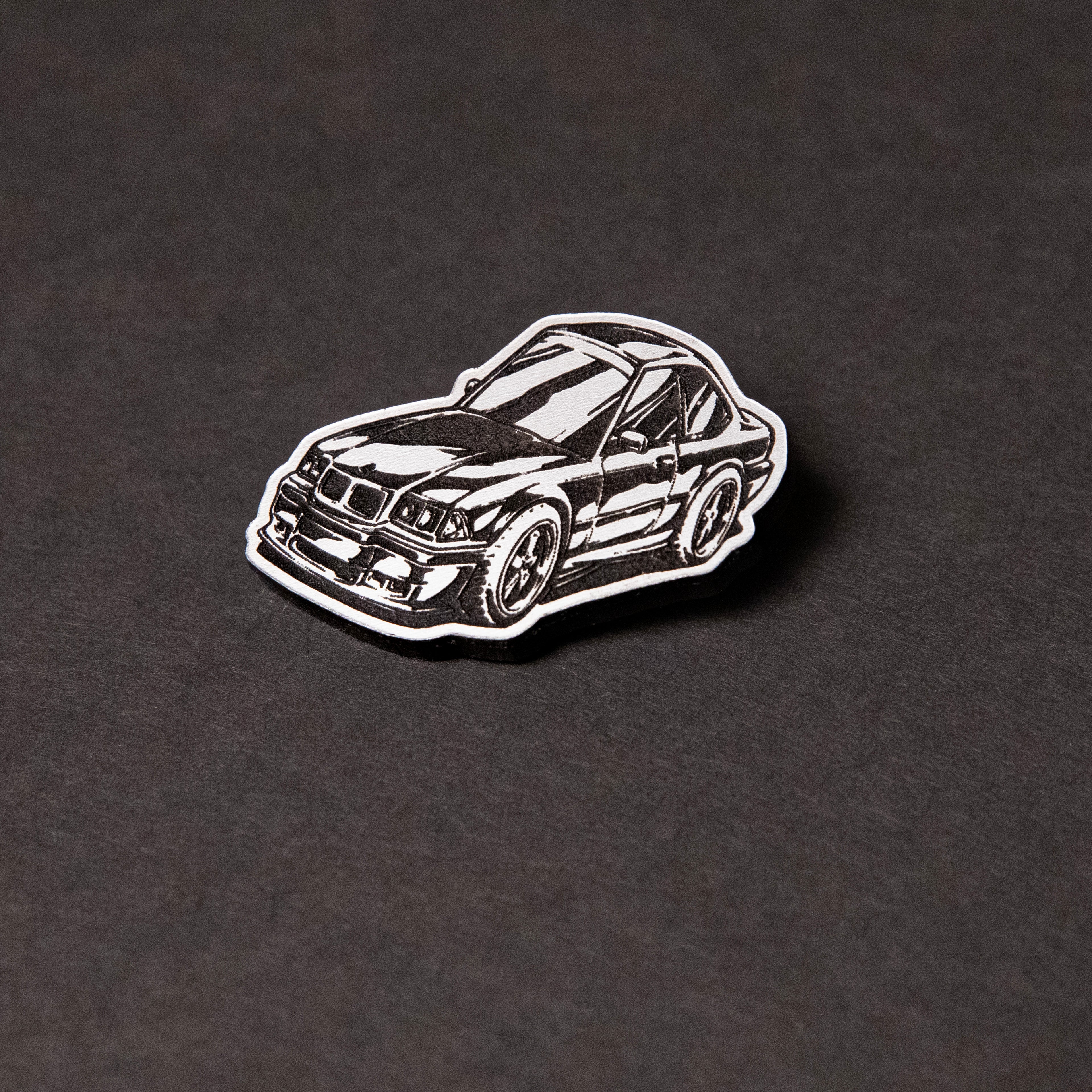 Silver and black engraved chibi BMW E36 acrylic lapel pin