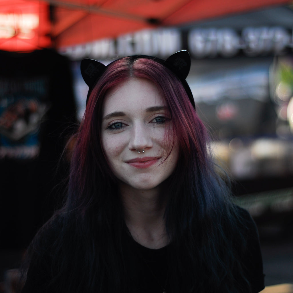Black laser-engraved acrylic Black Cloud cat ears on a velvet black headband.