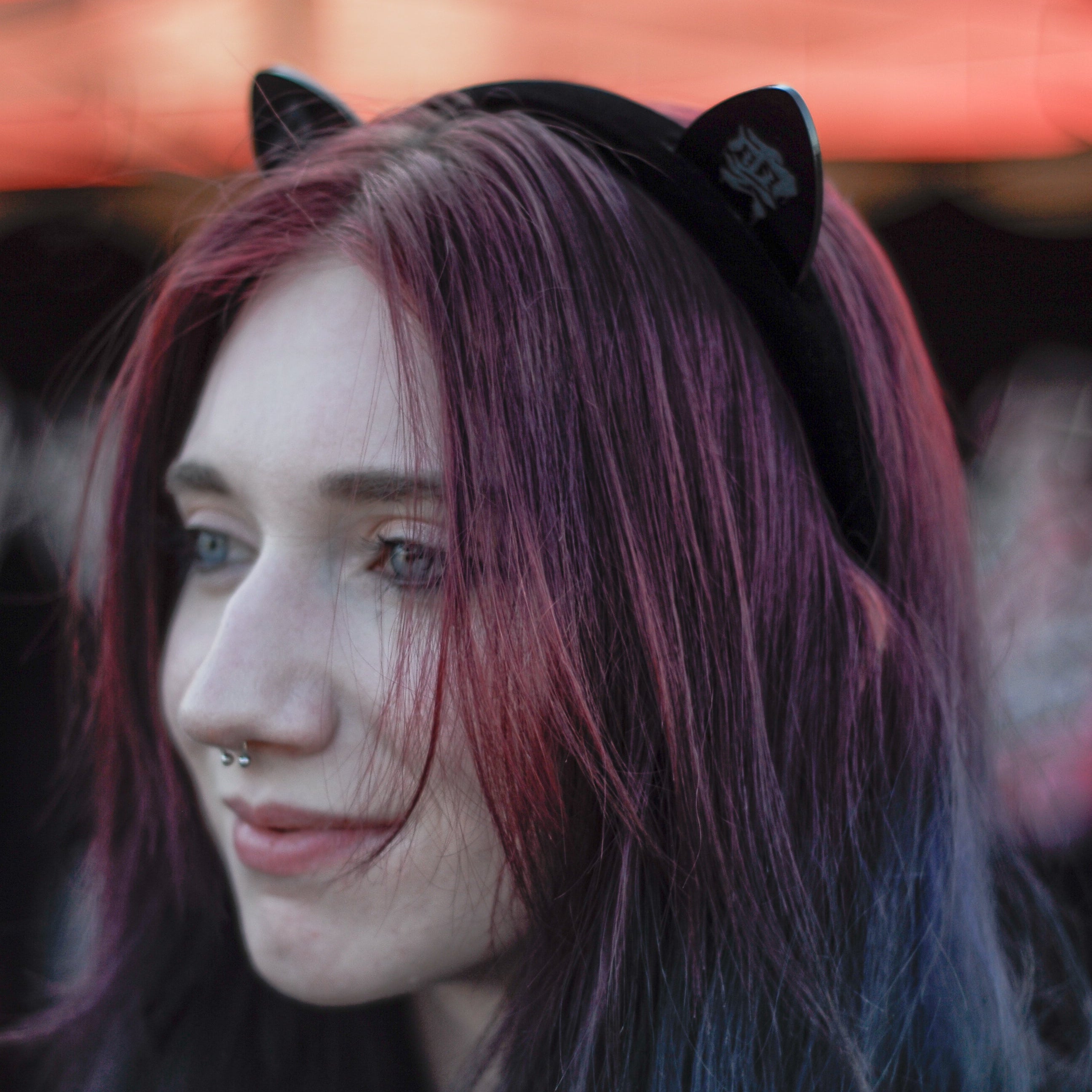 Black laser-engraved acrylic Black Cloud cat ears on a velvet black headband.
