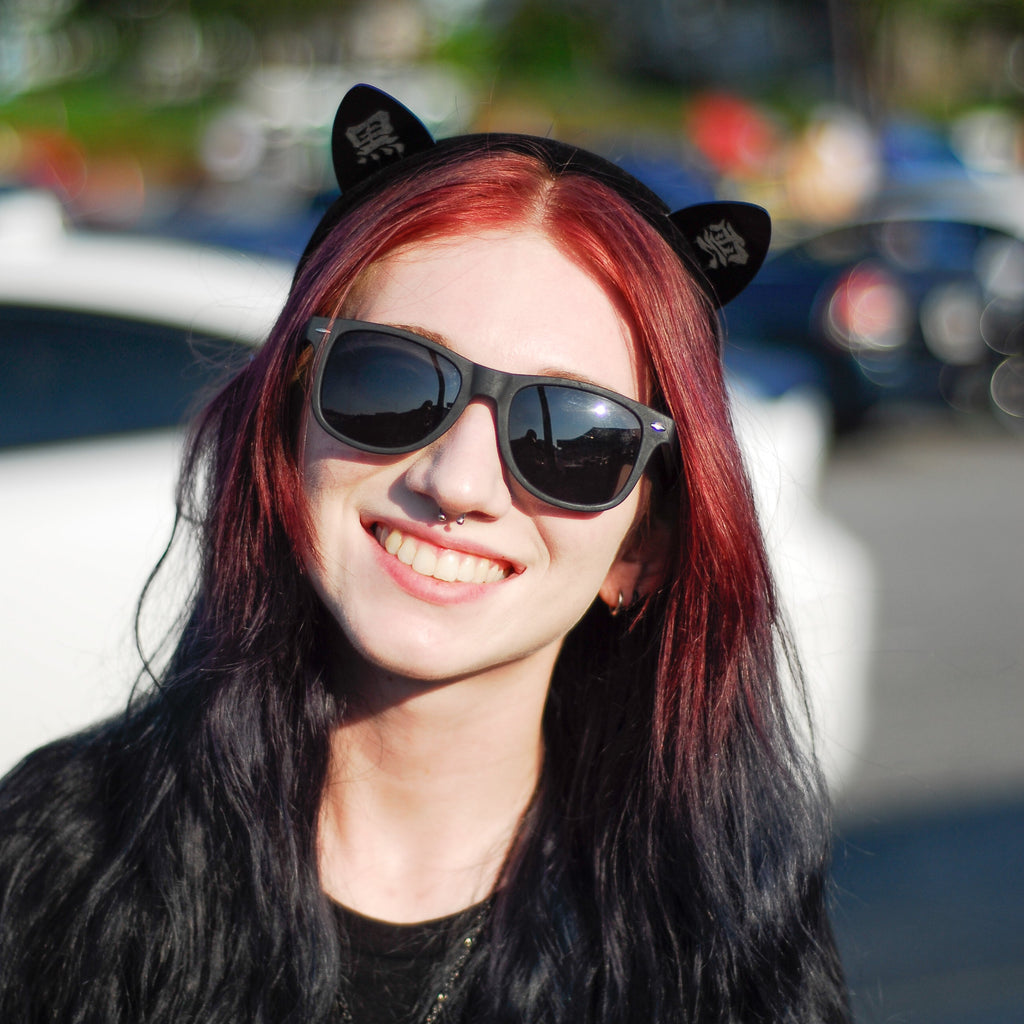 Black laser-engraved acrylic Black Cloud cat ears on a velvet black headband.