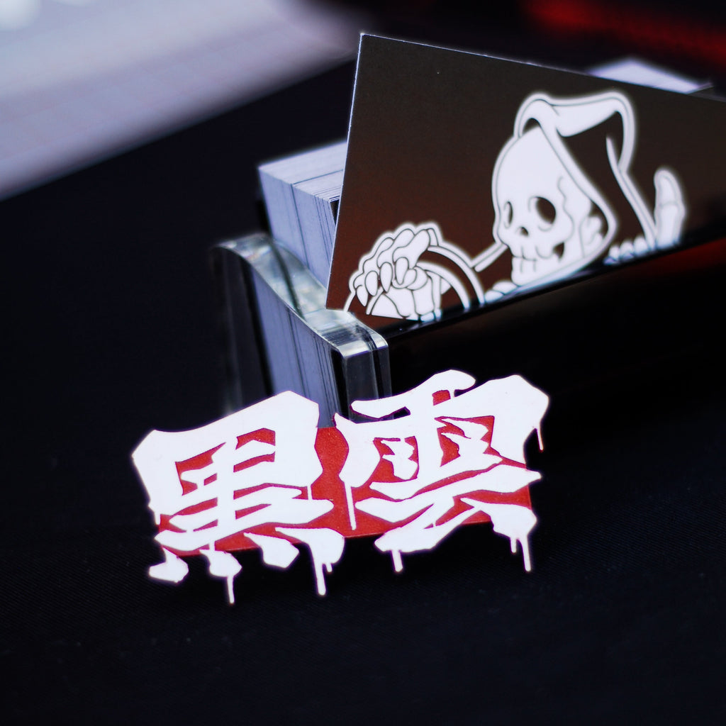 Red and white laser-engraved acrylic Black Cloud Japanese Kanji hair clip.