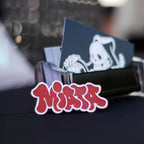 Red and white laser-engraved acrylic miata hair clip.