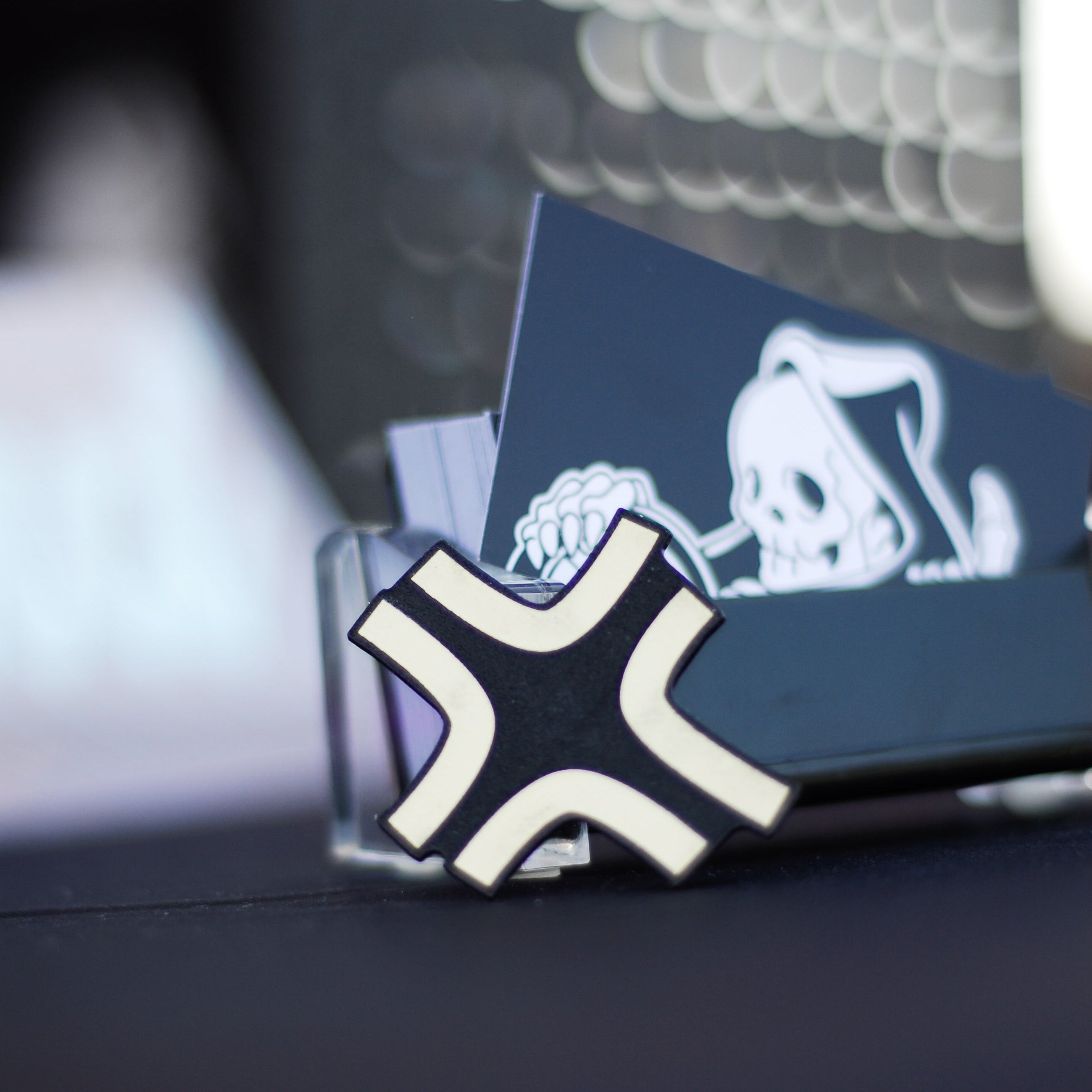 Black and gold laser-engraved acrylic Black Cloud angry anime symbol hair clip.