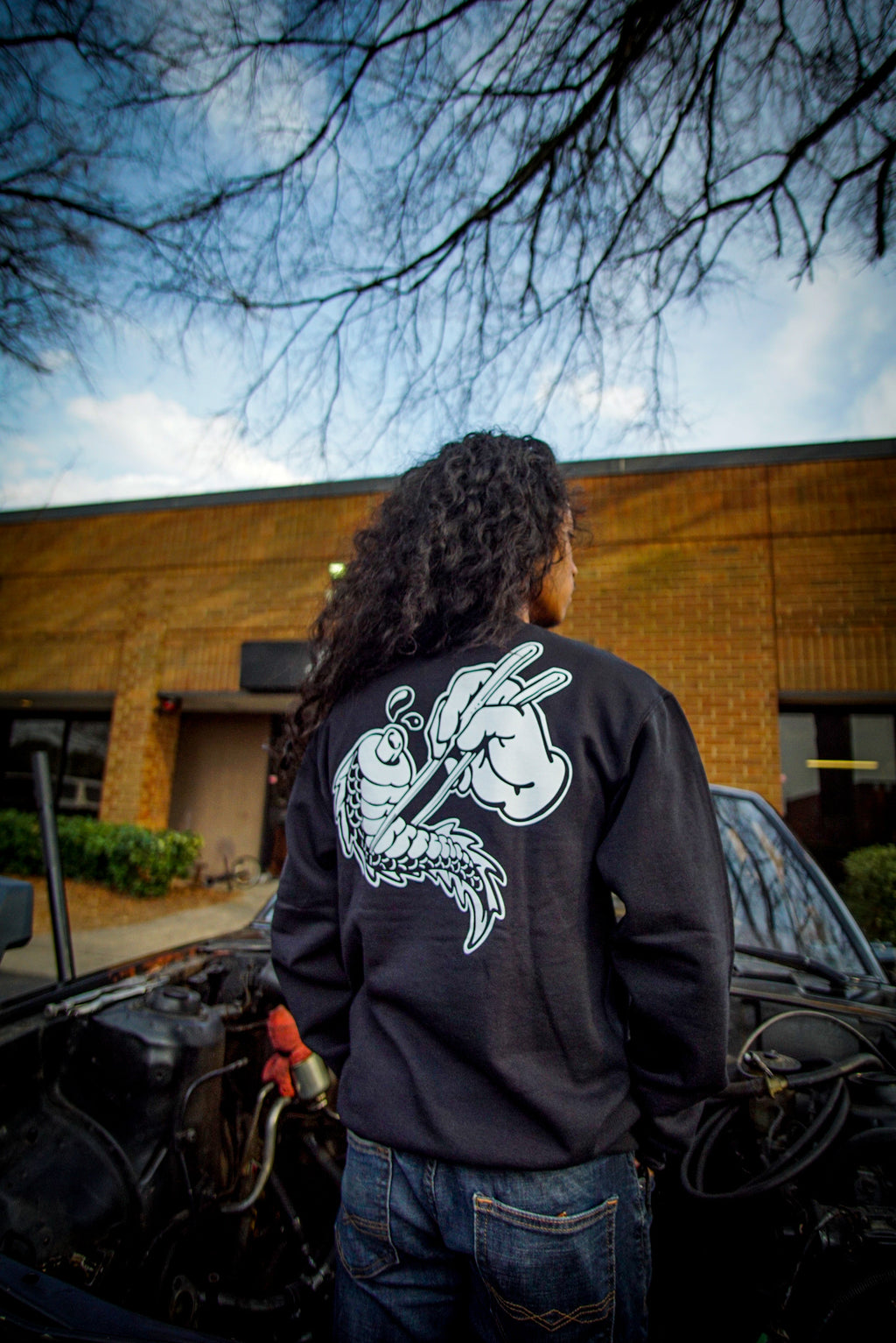 Unisex cotton black crewneck sweatshirt with tōge (roadway) chest emblem on front in white ink and conquering the tail of the dragon design in white on back.