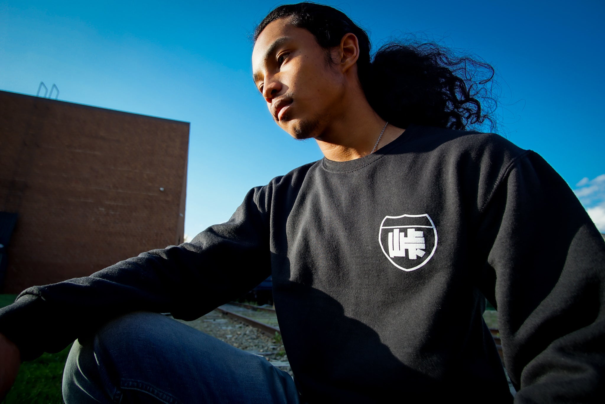 Unisex cotton black crewneck sweatshirt with tōge (roadway) chest emblem on front in white ink and conquering the tail of the dragon design in white on back.