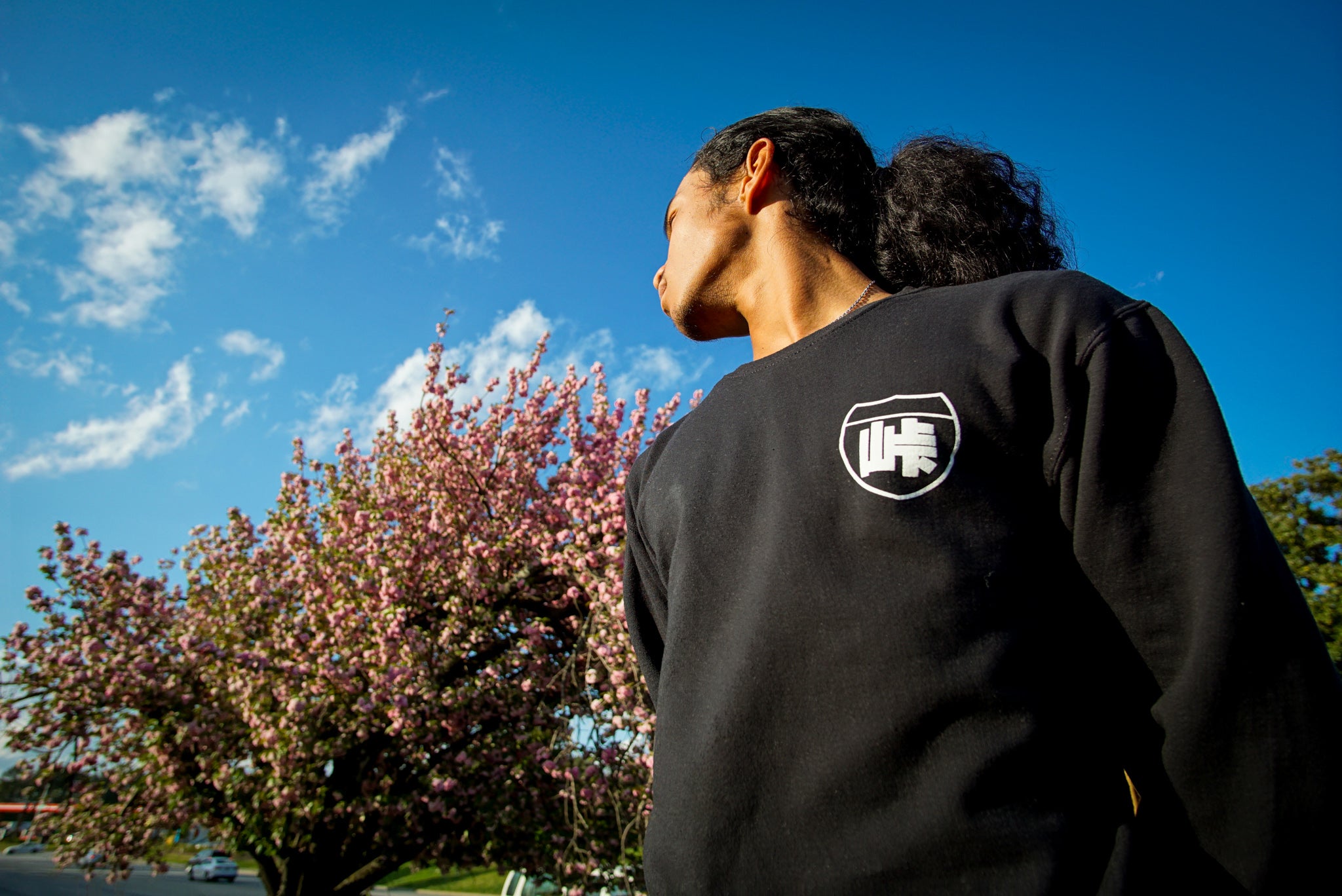Unisex cotton black crewneck sweatshirt with tōge (roadway) chest emblem on front in white ink and conquering the tail of the dragon design in white on back.