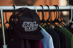 Black Cloud Japanese Katakana in white vinyl on black snapback hat.
