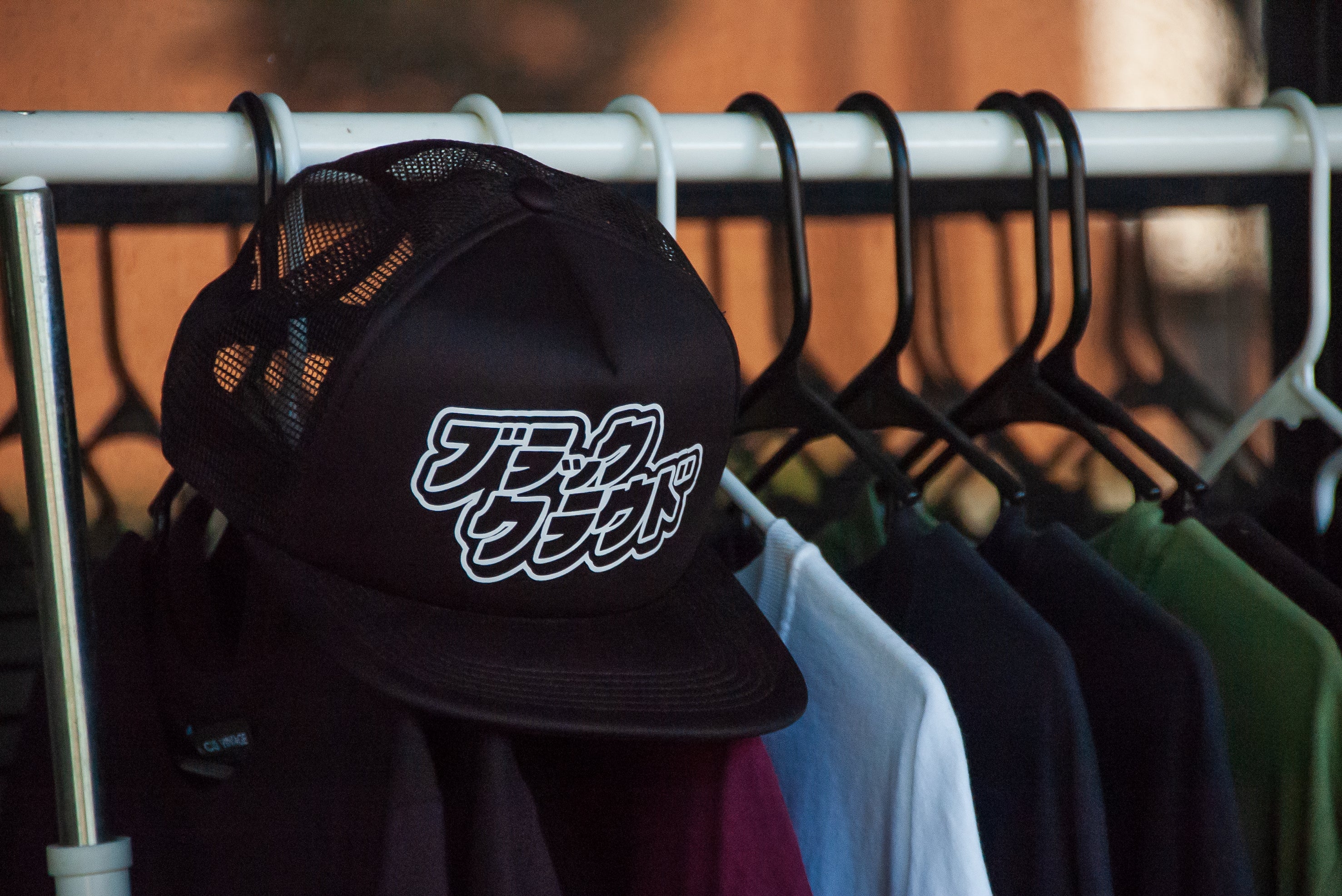 Black Cloud Japanese Katakana in white vinyl on black snapback hat.