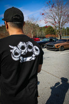 Black cotton short-sleeved T-shirt with Problem Solver brass knuckle design on back in white ink