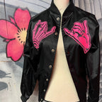Black unisex nylon lined baseball jacket with promise (Yakusoku) design on front in hot pink