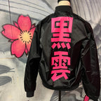Black unisex nylon lined baseball jacket with promise (Yakusoku) design on front and black cloud Japanese kanji letters on the back in hot pink
