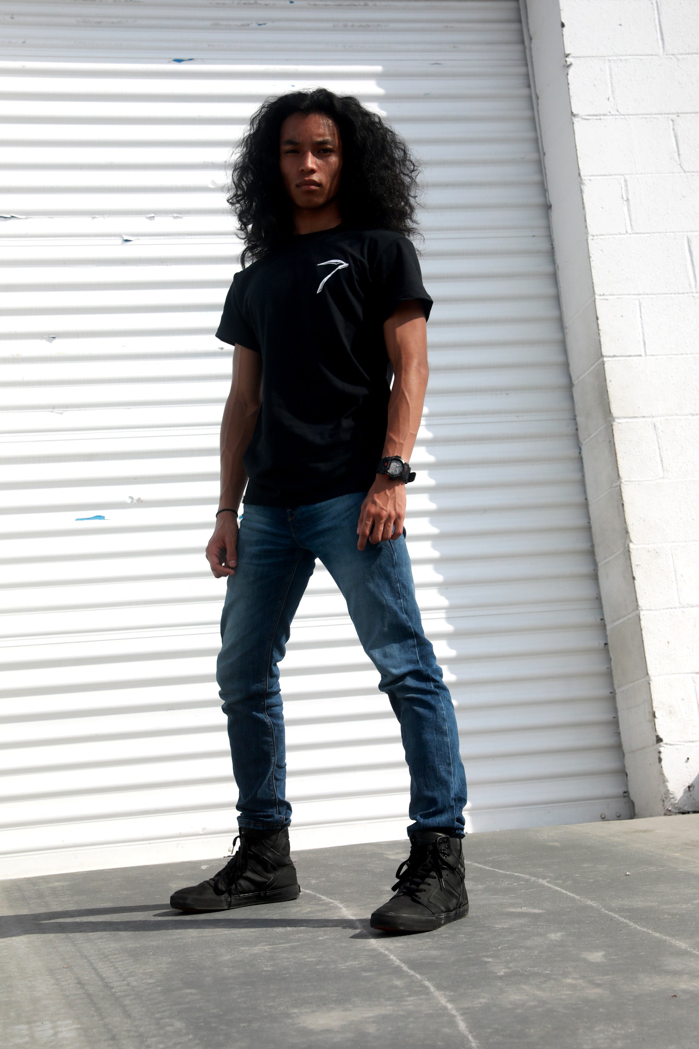Black unisex cotton short-sleeved T-shirt with Grim Reaper Do or Die design on back and small scythe chest emblem on front in white ink. 