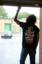 Black short-sleeve unisex T-shirt with Miss Chief design on back