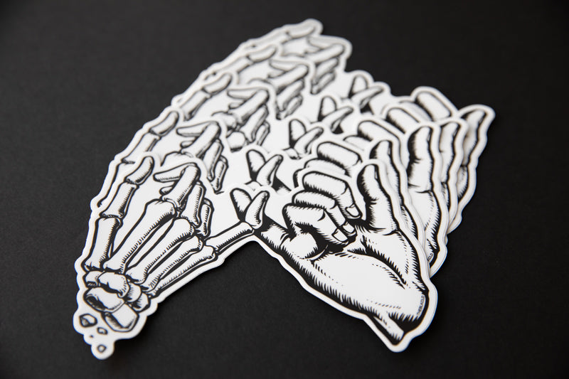 Multiple black and white Yakusoku (Promise) vinyl stickers.