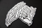 Multiple black and white Yakusoku (Promise) vinyl stickers.