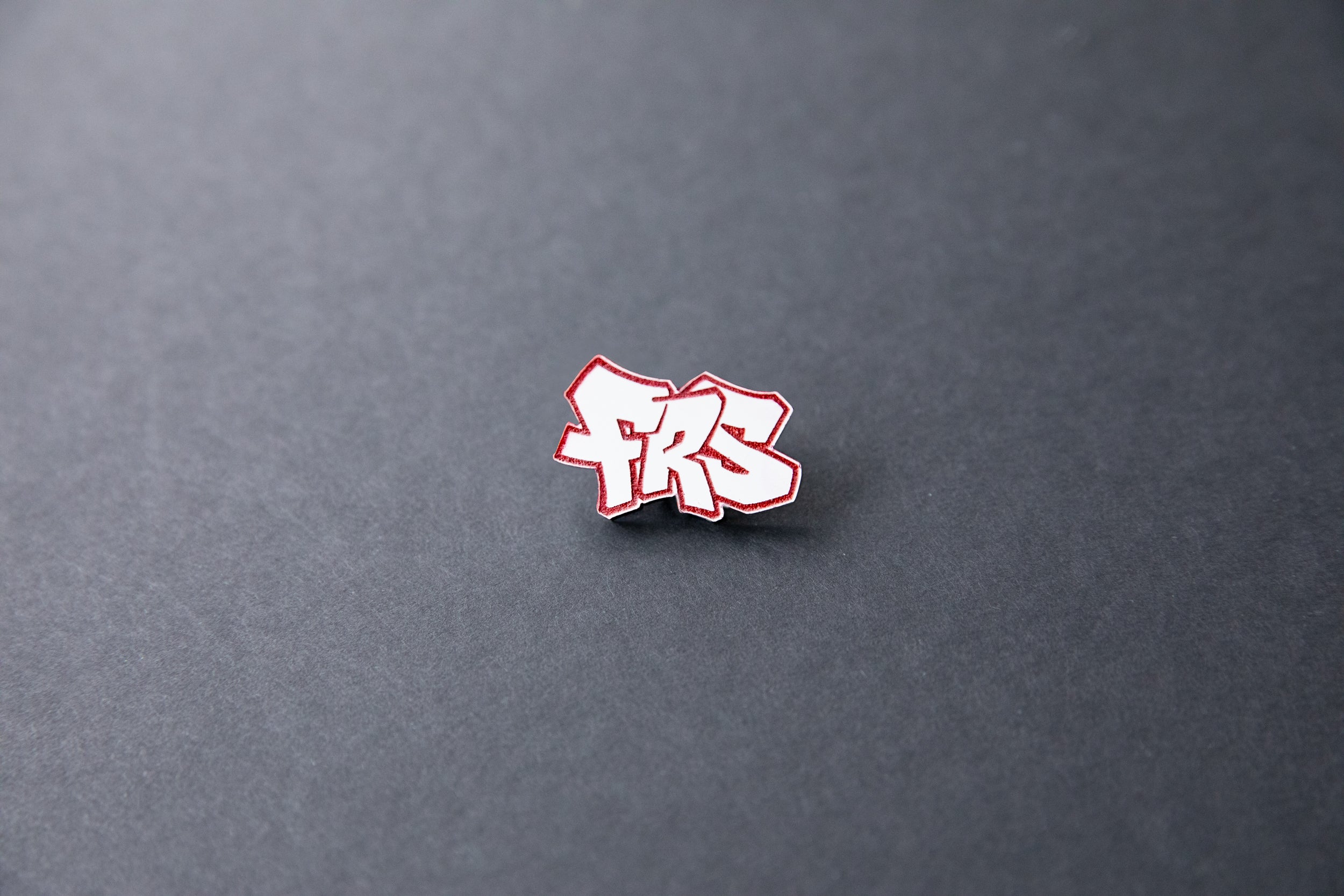 red FRS acrylic lapel pin