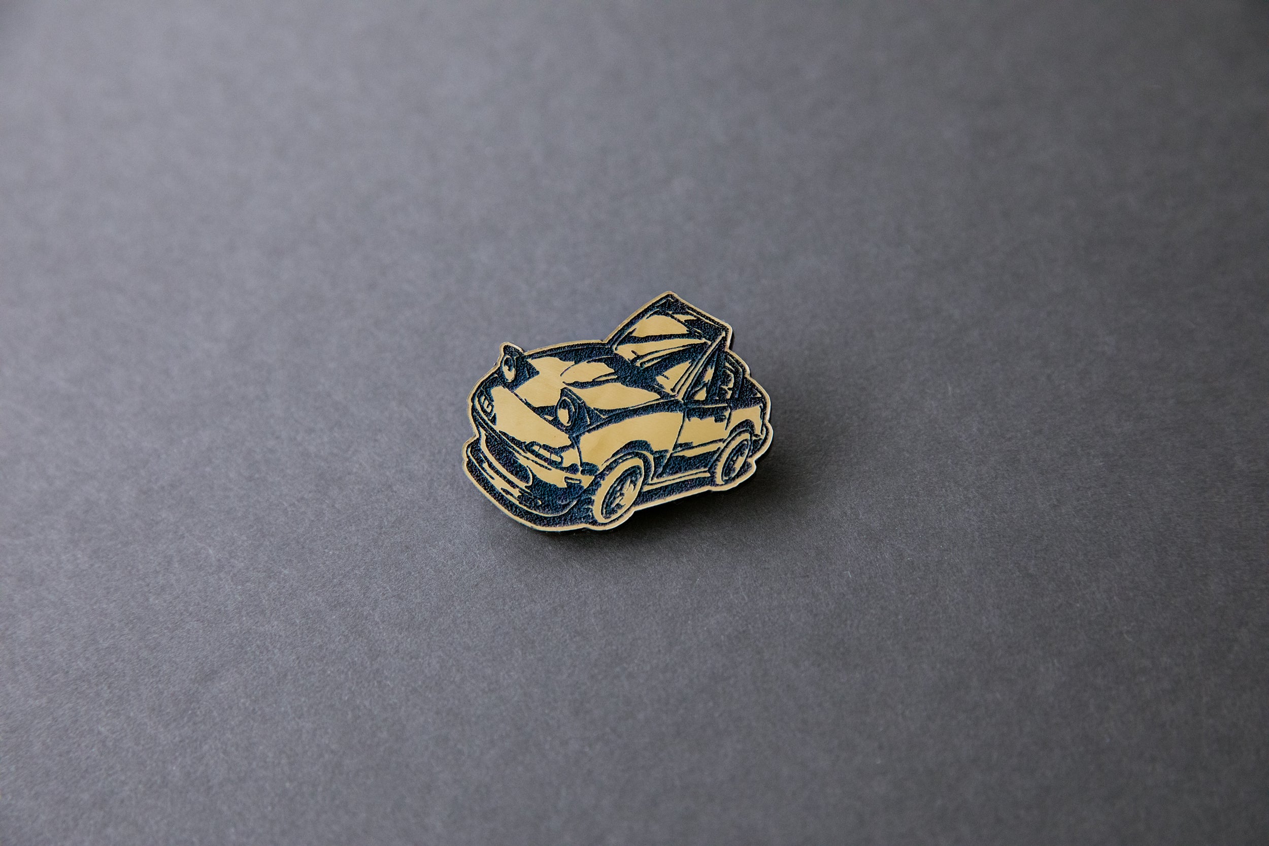 gold chibi Miata car acrylic lapel pin