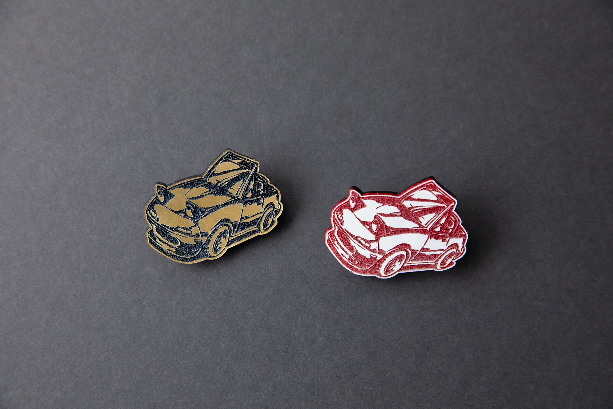 gold and red chibi Miata car acrylic lapel pins