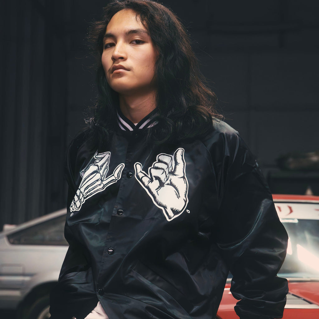 Black unisex nylon lined baseball jacket with promise (Yakusoku) design on front in white