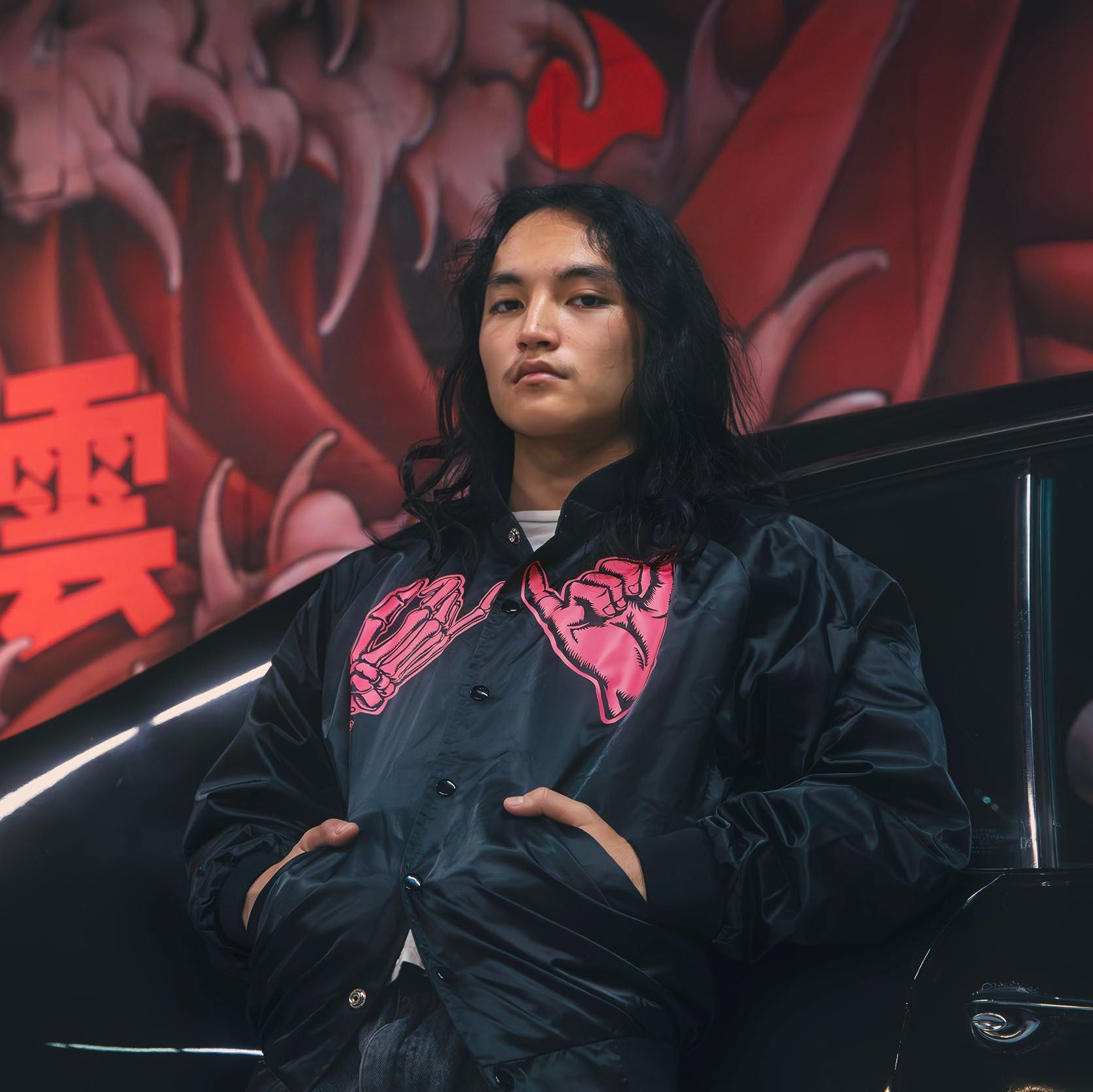 Black unisex nylon lined baseball jacket with promise (Yakusoku) design on front in hot pink