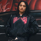 Black unisex nylon lined baseball jacket with promise (Yakusoku) design on front in hot pink