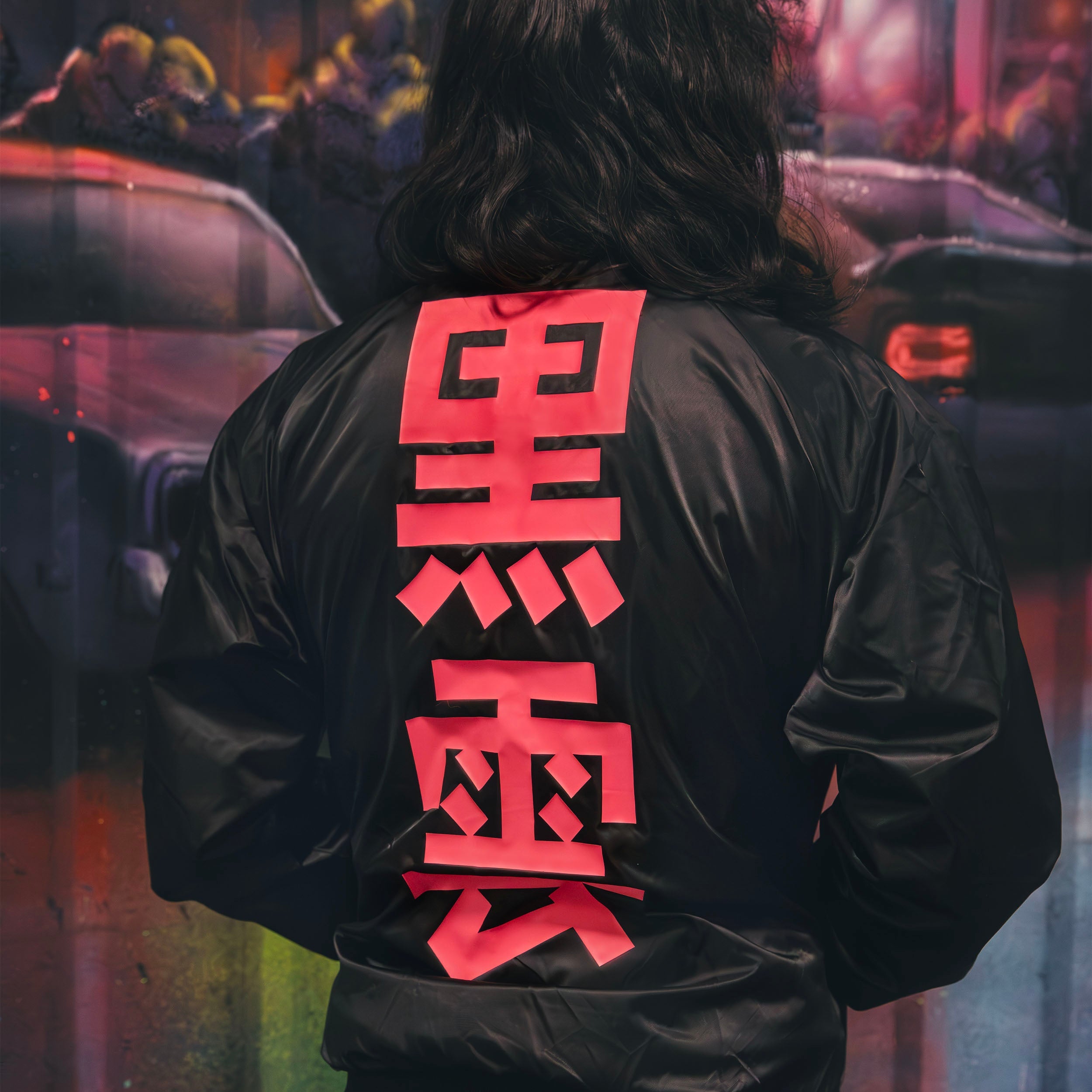 Black unisex nylon lined baseball jacket with promise (Yakusoku) design on front and black cloud Japanese kanji letters on the back in hot pink