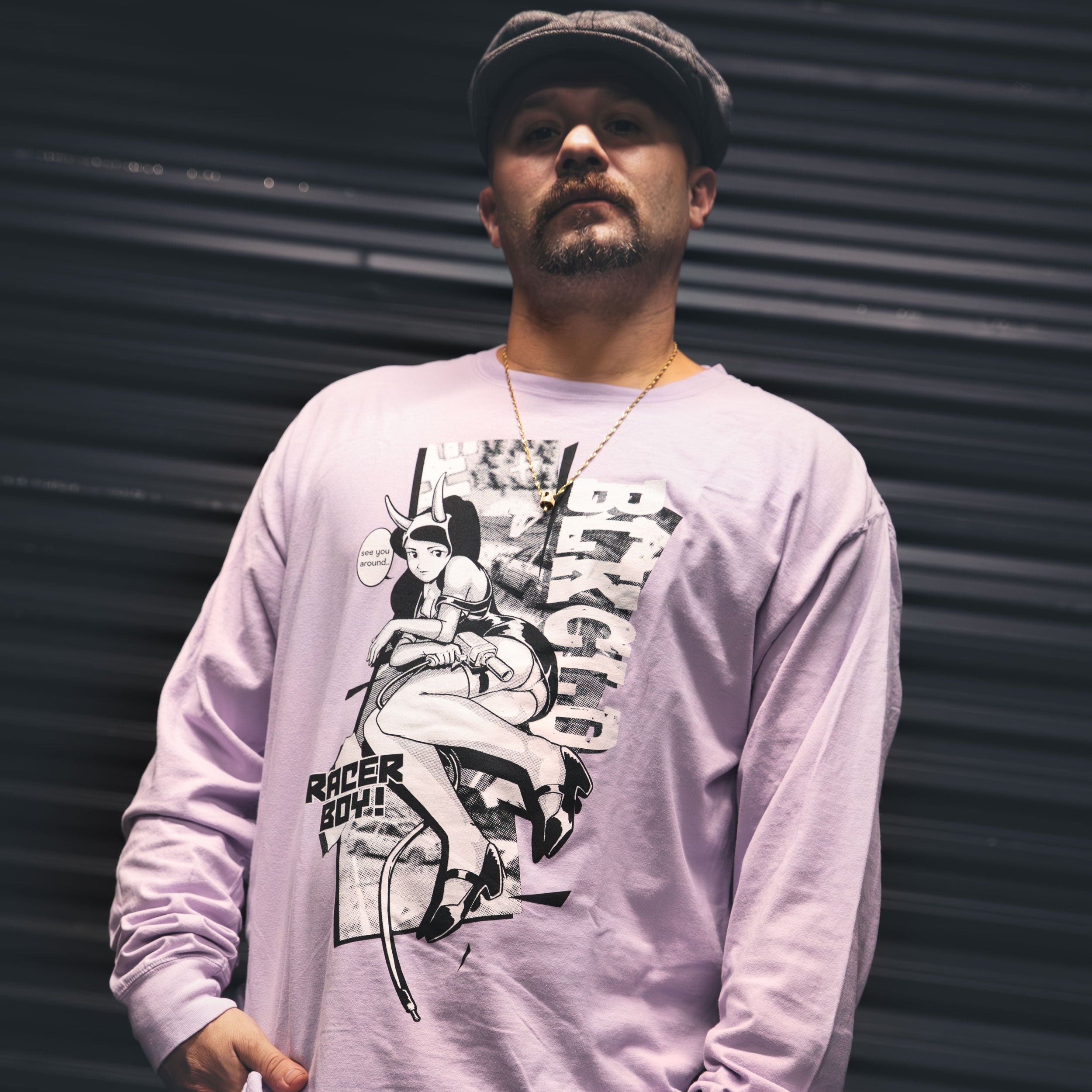 Lavender unisex cotton long-sleeved T-shirt with racer boy design on the front in white and black ink.