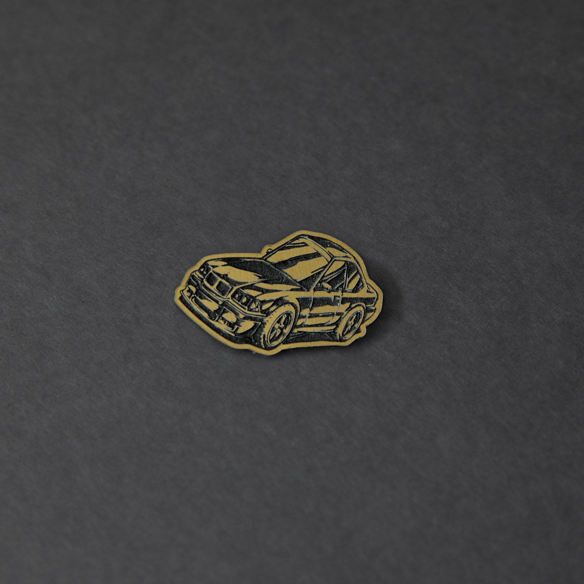 gold and black engraved chibi BMW E36 acrylic lapel pin