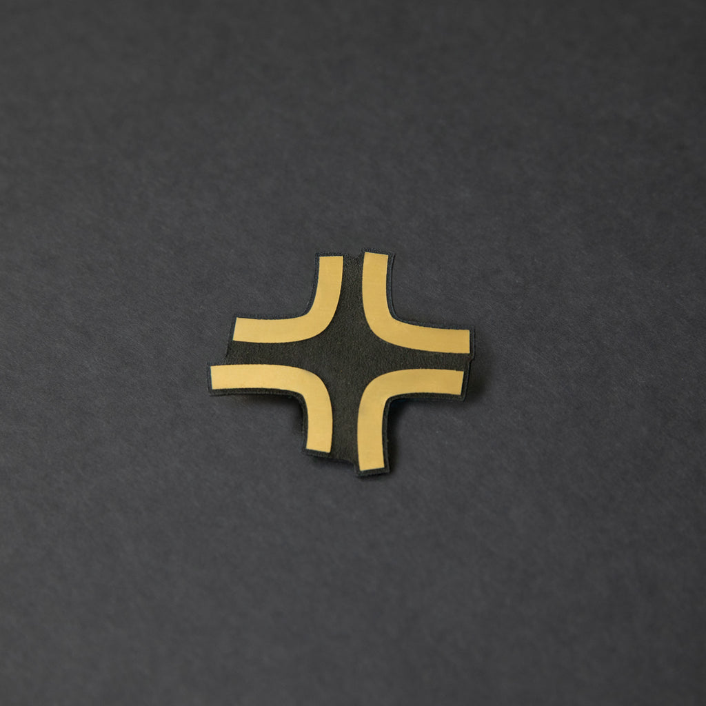 Black and gold laser-engraved acrylic Black Cloud angry anime symbol hair clip.