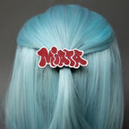 Red and white laser-engraved acrylic miata hair clip.