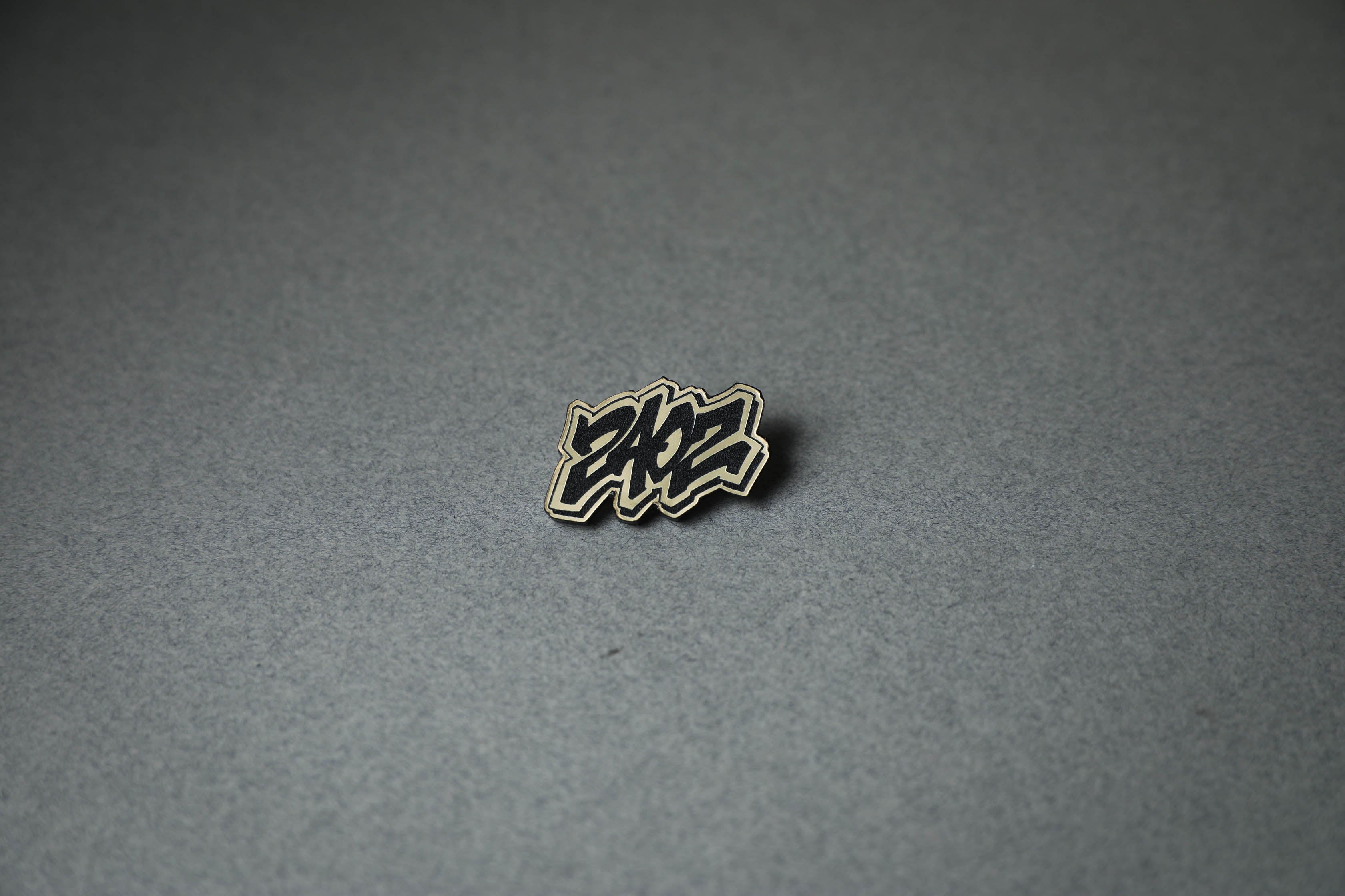 240Z letter gold acrylic lapel pin.