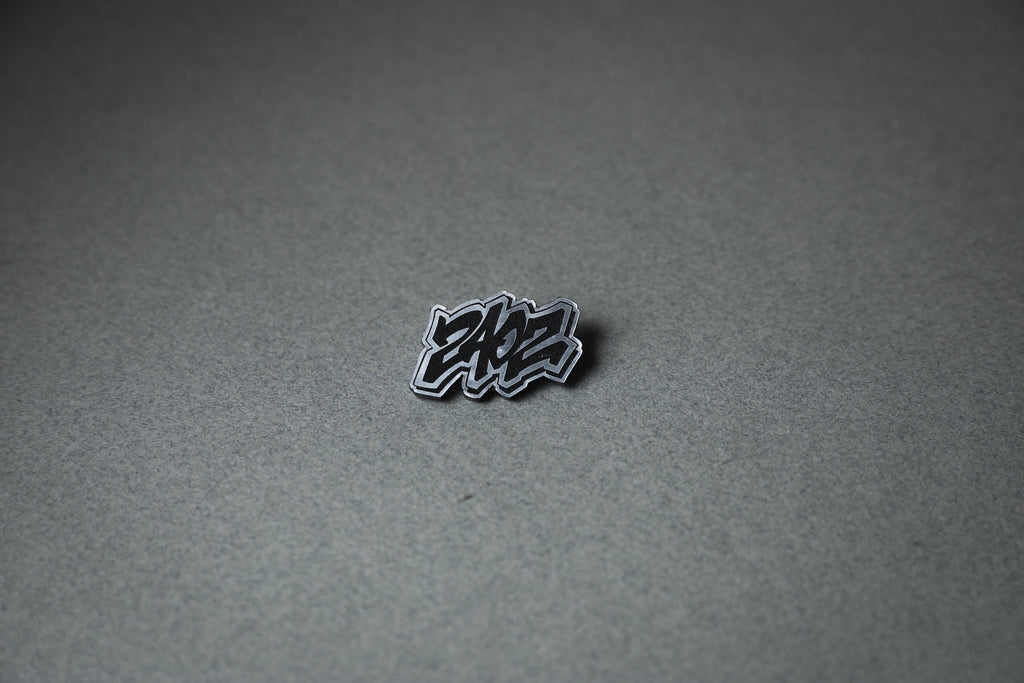 240Z letter silver acrylic lapel pin.