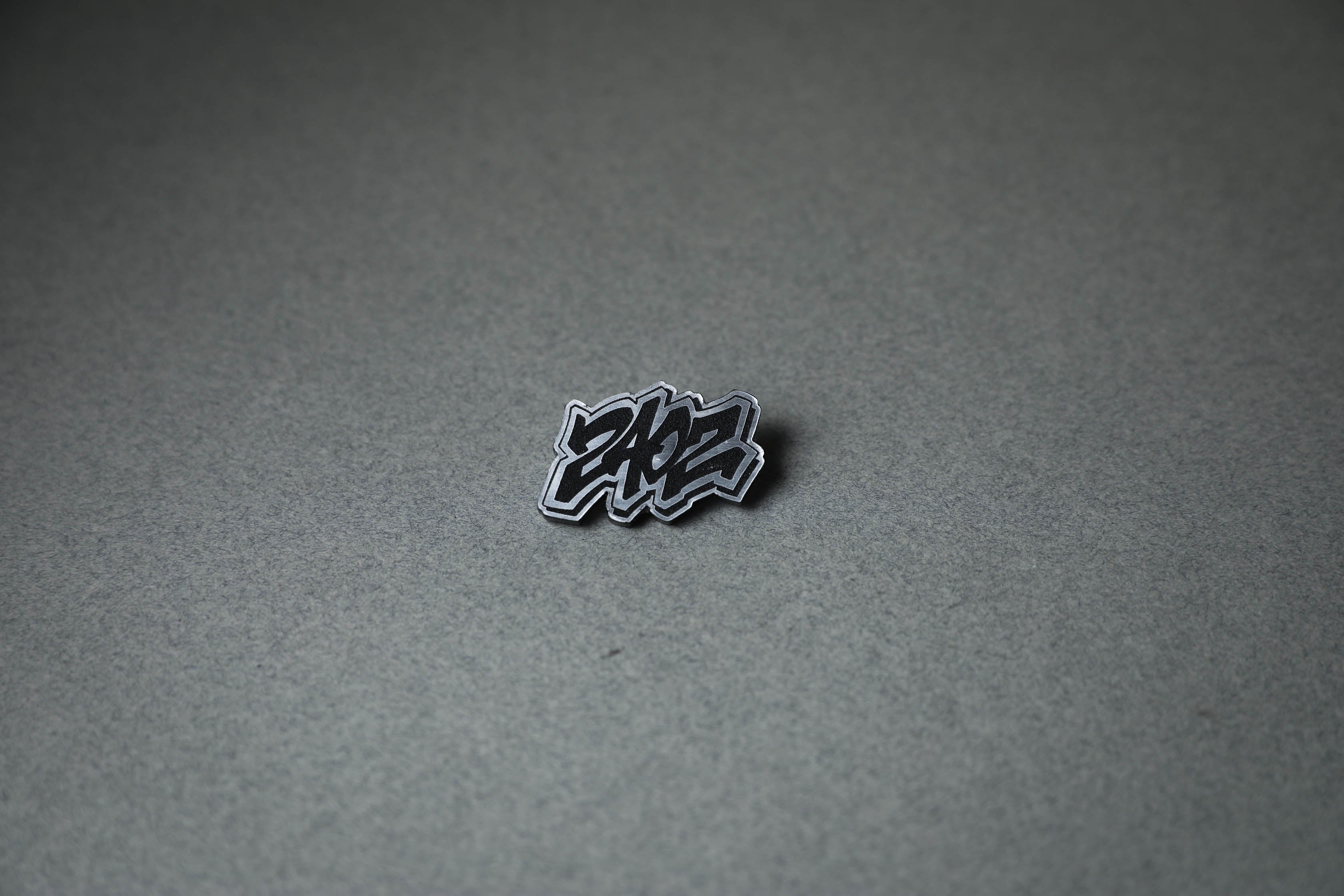 240Z letter silver acrylic lapel pin.