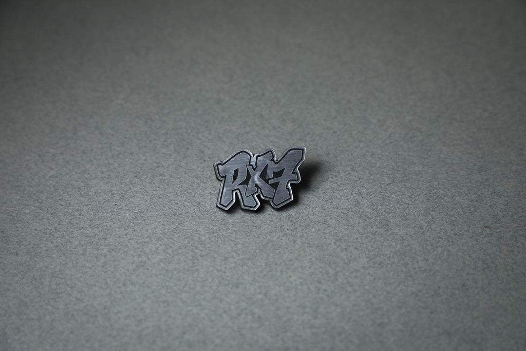 silver RX7 acrylic lapel pin