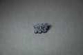silver RX7 acrylic lapel pin