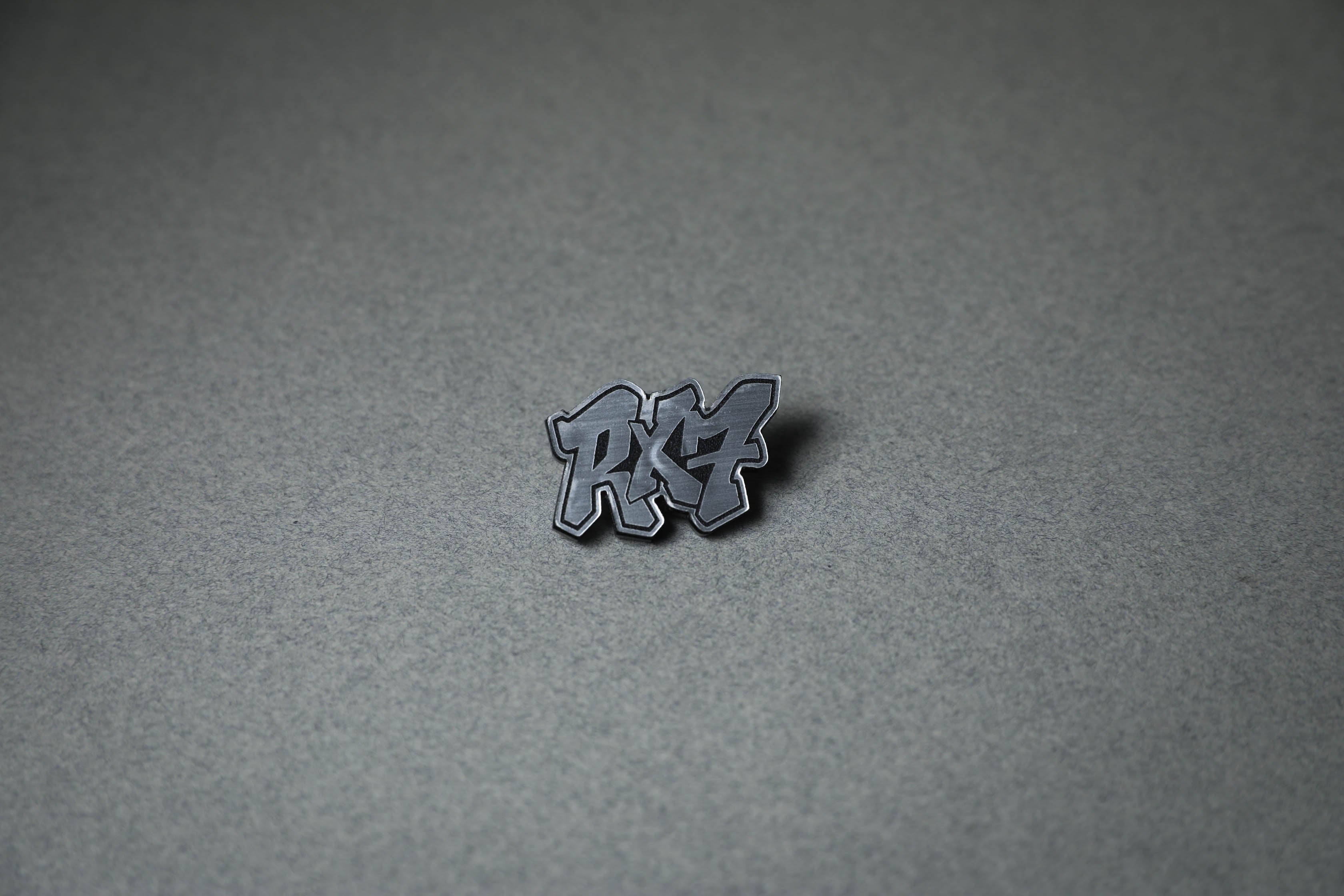 silver RX7 acrylic lapel pin