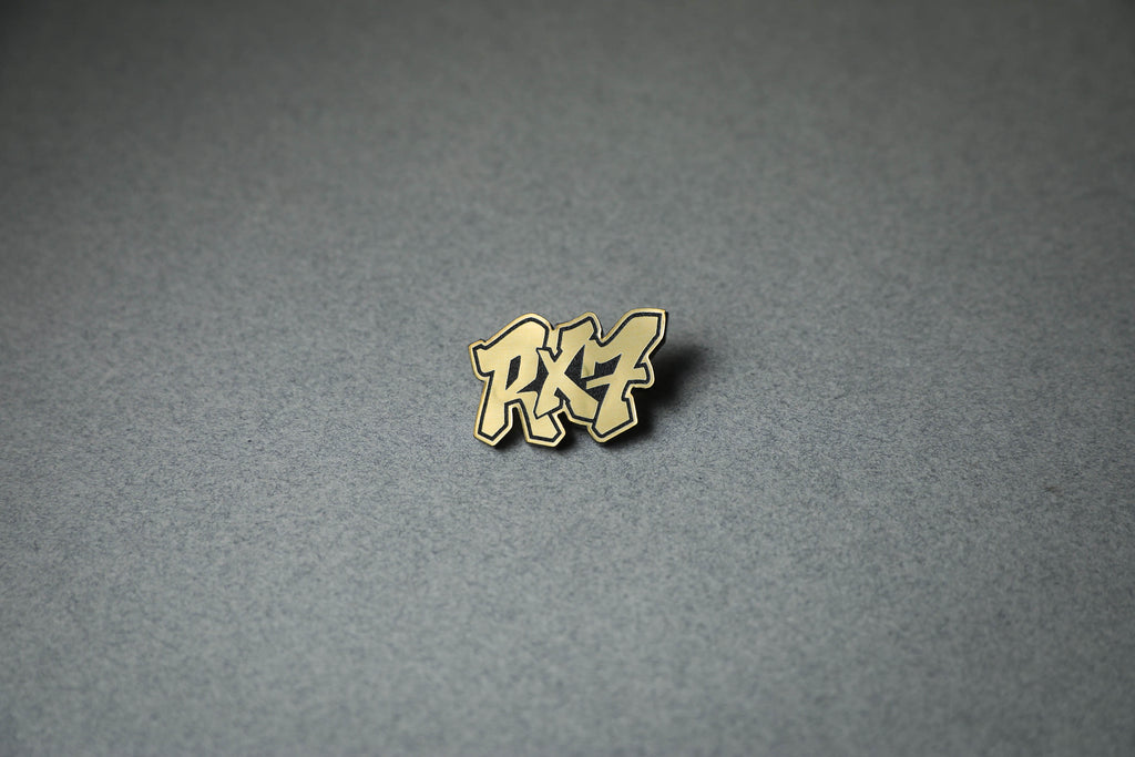 gold RX7 acrylic lapel pin