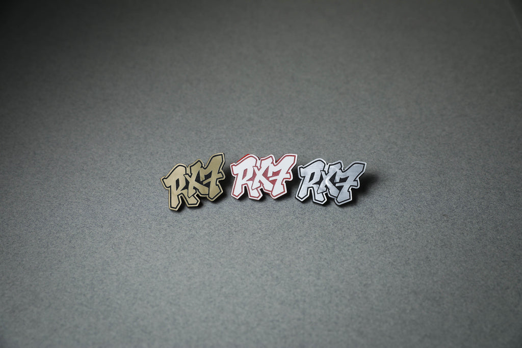 RX7 acrylic lapel pins in gold, red or silver