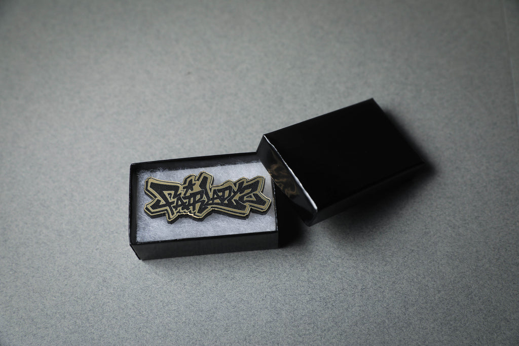 Fairlady Z gold acrylic lapel pin in jewelry box