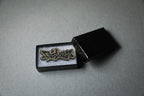 Fairlady Z gold acrylic lapel pin in jewelry box