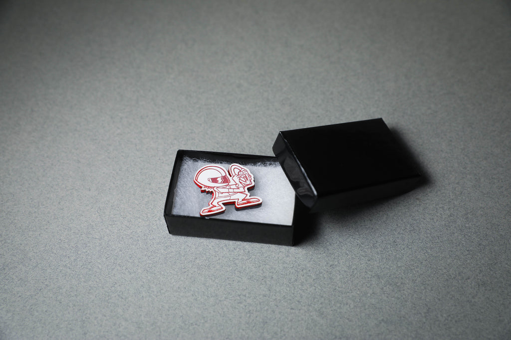 red driver acrylic lapel pin in jewelry box