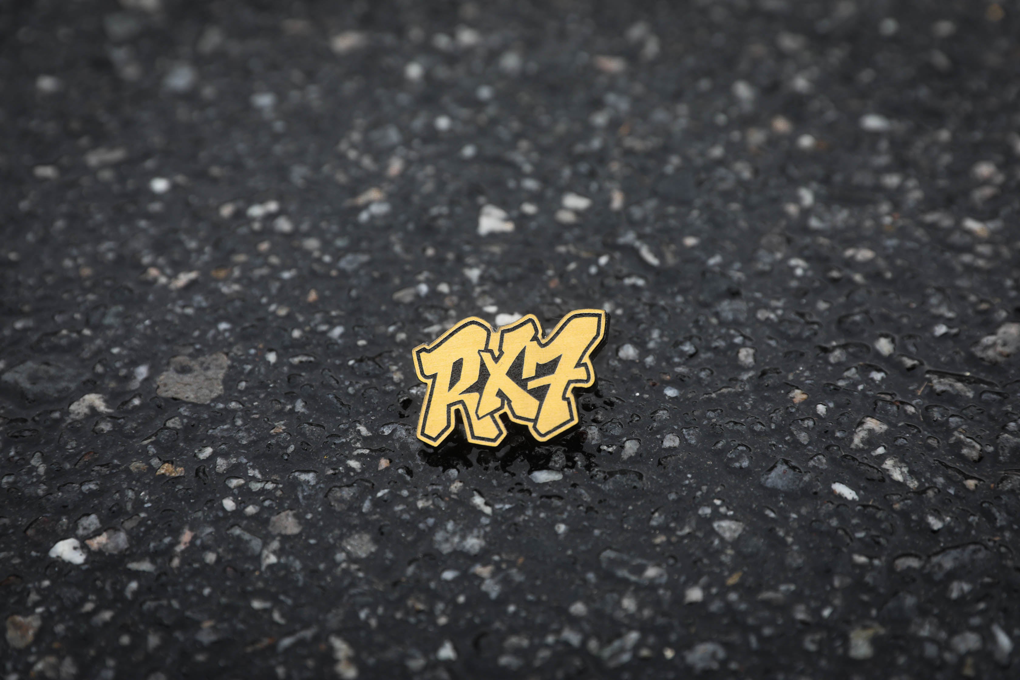gold RX7 acrylic lapel pin